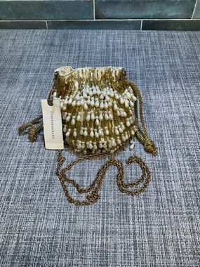 Anthropologie Gold Beaded Drawstring Crossbody Bag